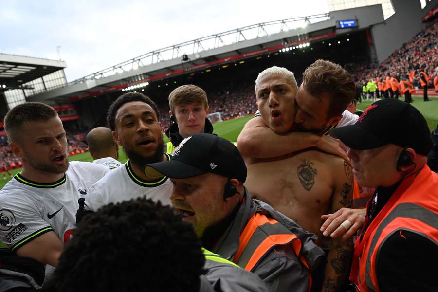 Tottenham Hotspur's Brazilian striker Richarlison (3R) gets a kiss from Tottenham Hotspur's English striker Harry Kane (2R) as he celebrates after scoring their third goal