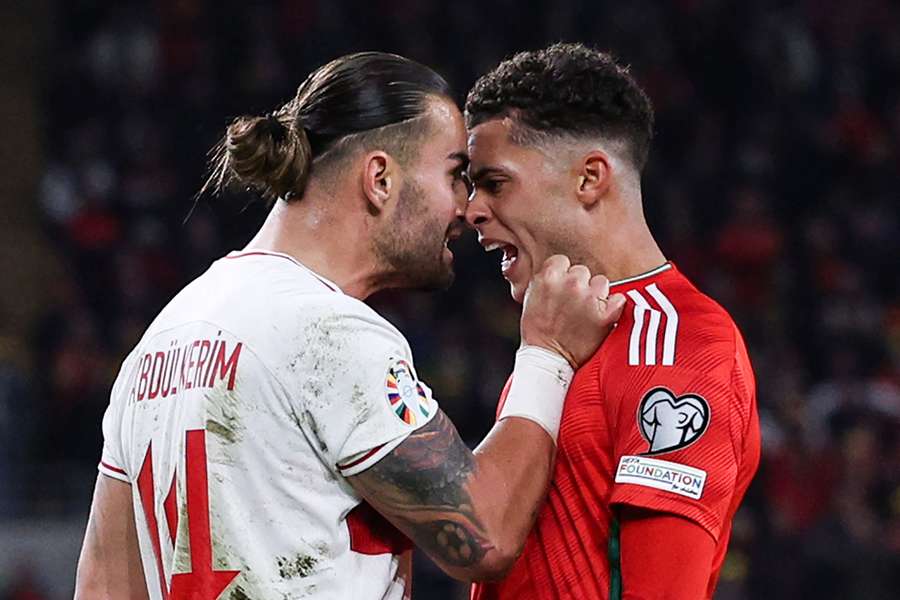 Abdulkerim Bardakci argues with Wales midfielder Brennan Johnson