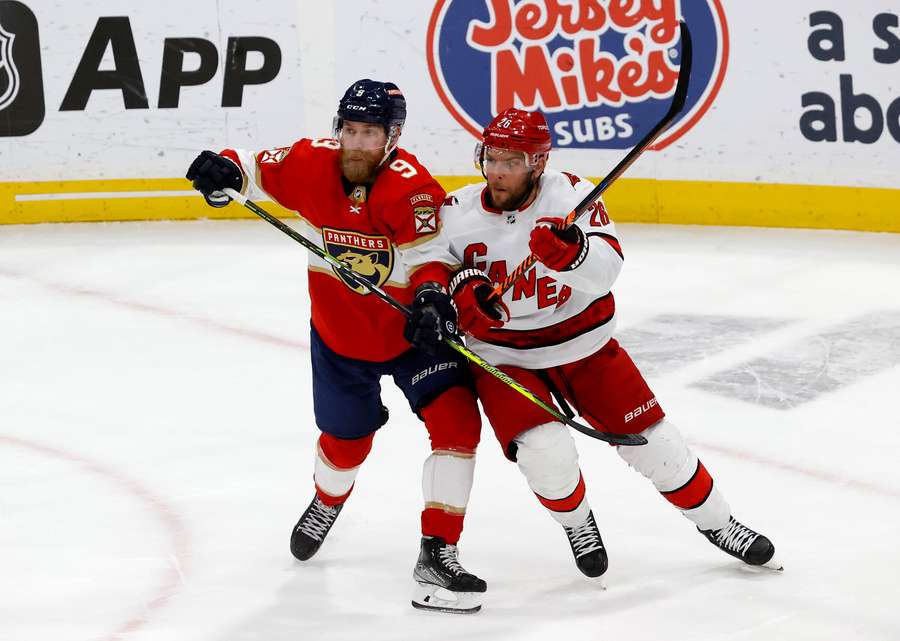 Paul Stastny of the Carolina Hurricanes collides with Sam Bennett of the Florida Panthers