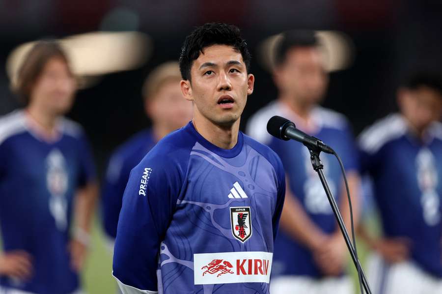 Japan's Wataru Endo speaks to fans during the send-off ahead of the World Cup