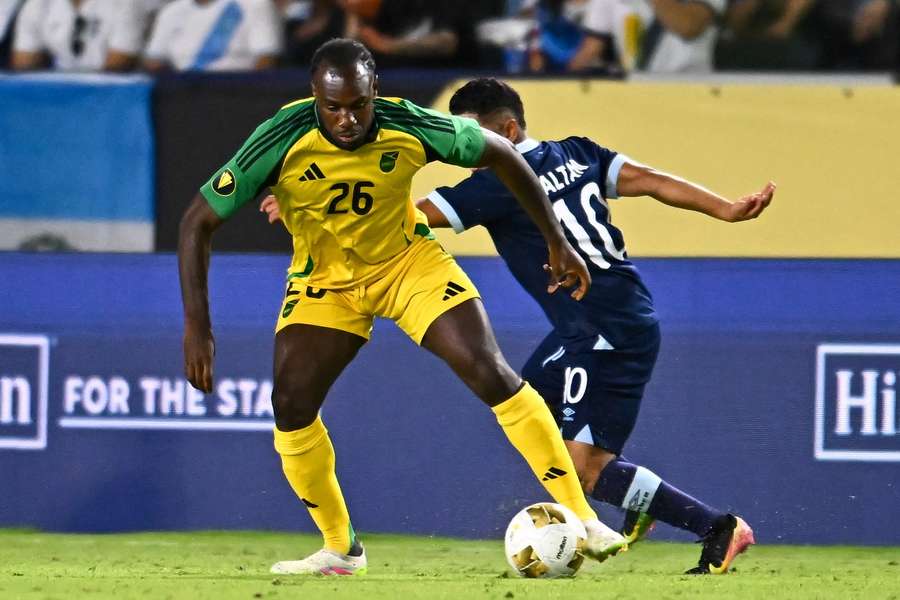 Jamaica forward Michail Antonio (26) controls the ball against Guatemala midfielder Pedro Altan (10)