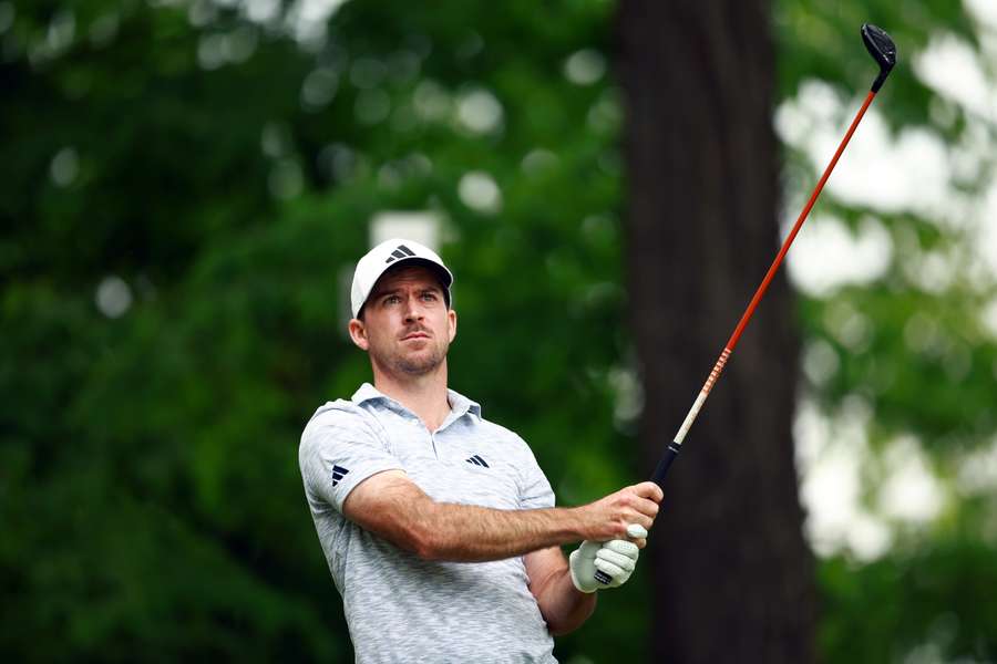 Nick Taylor of Canada hits his first shot on the 18th hole Nick Taylor of Canada hits his first shot on the 18th hole
