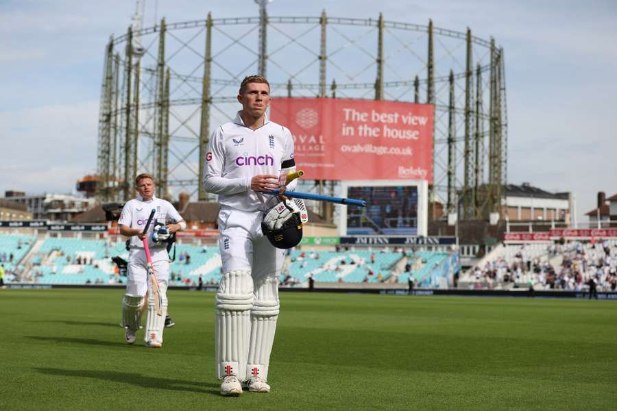 England batsmen Zak Crawley (R) and Ollie Pope leave the field