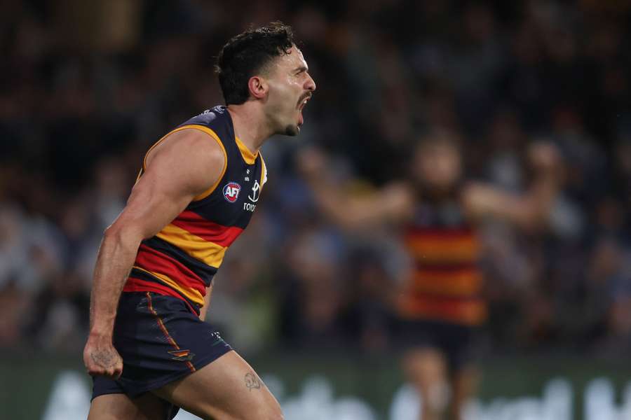 Izak Rankine celebrates a goal against Collingwood last weekend.
