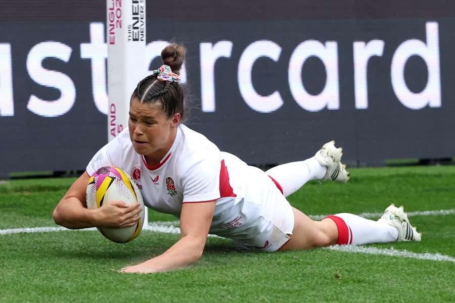 Jess Breach of England scores her team's second try during the Women's Rugby World Cup