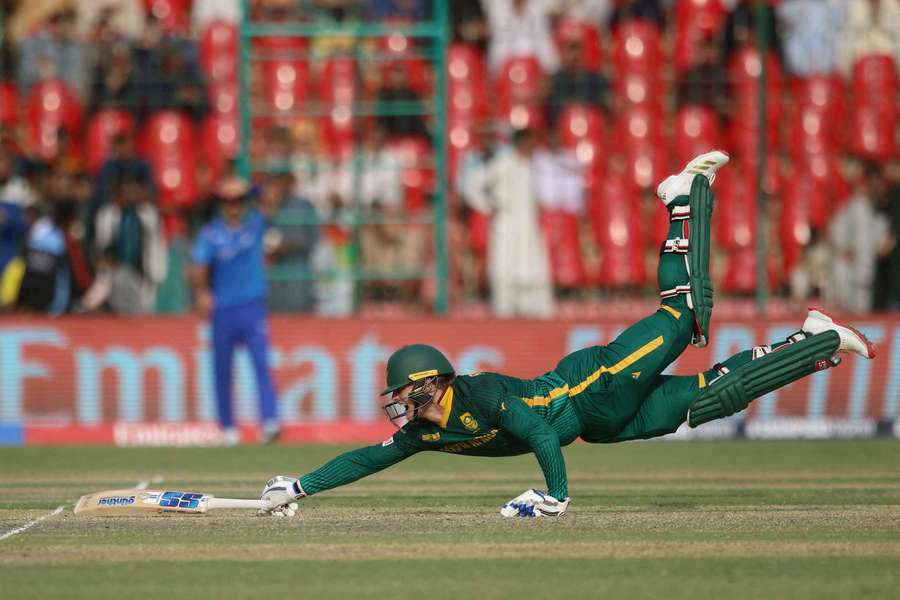 South Africa's Ryan Rickleton dives to avoid a run-out against Afghanistan