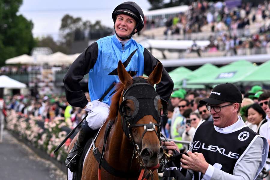 Jamie Melham (formerly Kah) soaks up the applause after winning the Melbourne Cup.  Jamie Melham (formerly Kah) soaks up the applause after winning the Melbourne Cup.