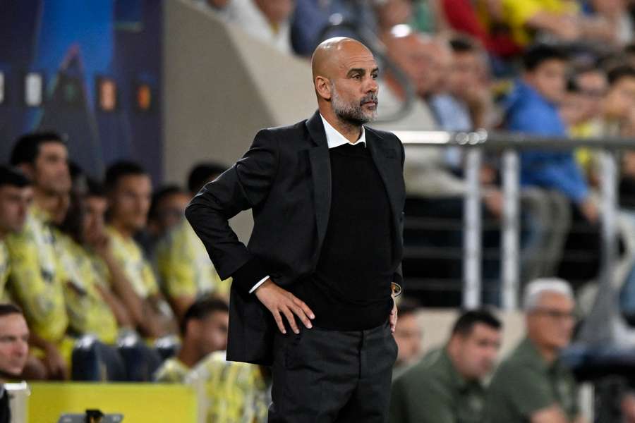 Pep Guardiola's City trail Arsenal by three points