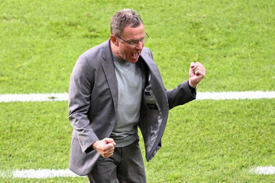 Austria coach Ralf Rangnick celebrates after the match 