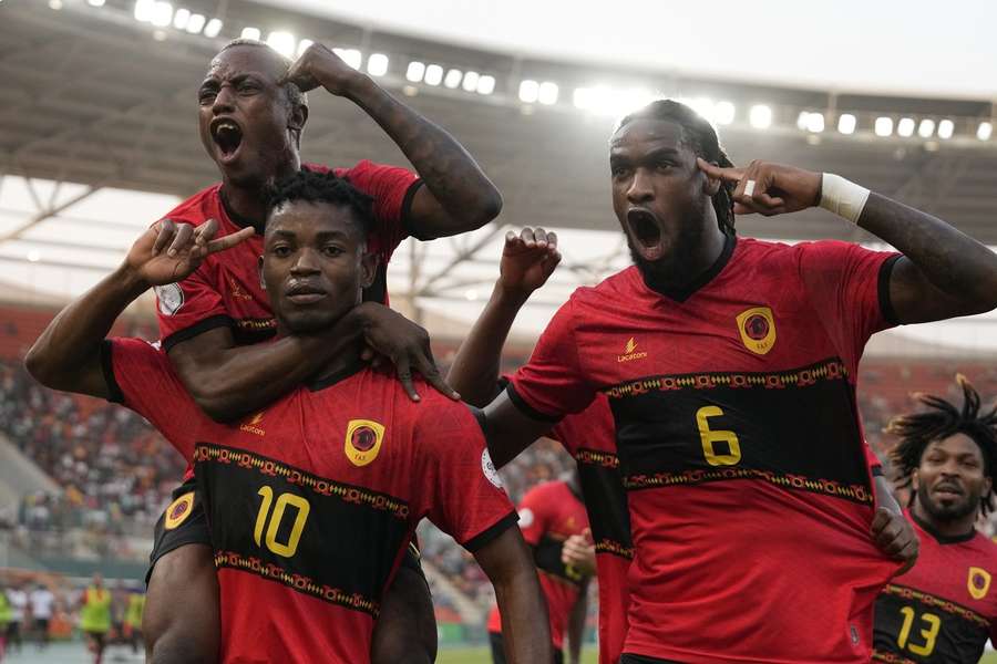 Angola celebrate Dala's goal