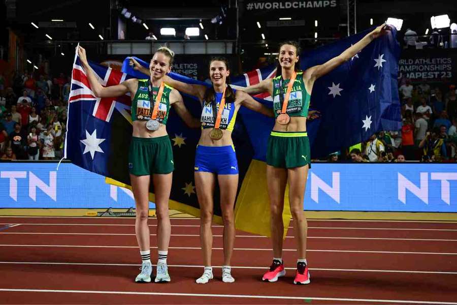 Eleanor Patterson, Yaroslava Mahuchikh and Nicola Olyslagers celebrate after the women's high jump final