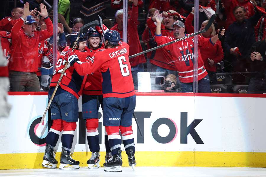 Capitals players celebrating a goal in Game 2 vs Carolina Hurricanes (2025 NHL Stanley Cup Playoffs)