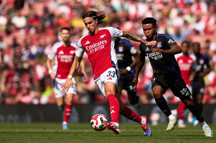 Gift Orban (right) challenging Arsenal's Riccardo Calafiori for the ball in the Emirates Cup