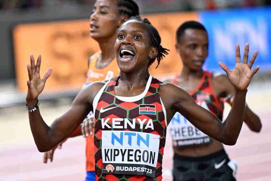 Faith Kipyegon reacts as she crosses the finish line to win the women's 5,000m final ahead of Sifan Hassan and Beatrice Chebet Faith Kipyegon reacts as she crosses the finish line to win the women's 5,000m final ahead of Sifan Hassan and Beatrice Chebet