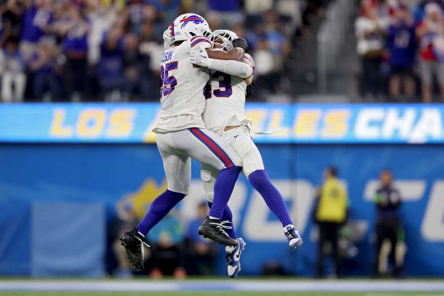 Tyrel Dodson and Terrel Bernard of the Buffalo Bills celebrate in the fourth quarter against the Los Angeles Chargers