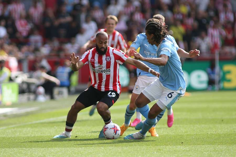 Mbeumo vies for the ball with Manchester City's Nathan Ake