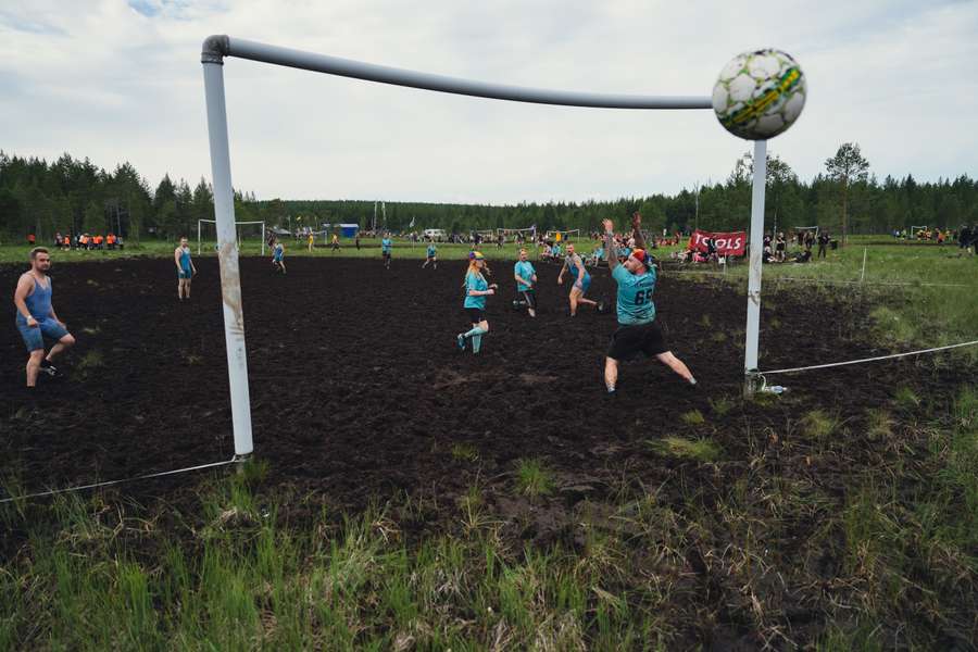 A team scores a goal during a match of swamp soccer on July 15, 2023 at the Swamp Soccer World Cup in the swamps of Vuorisuo in Hyrynsalmi