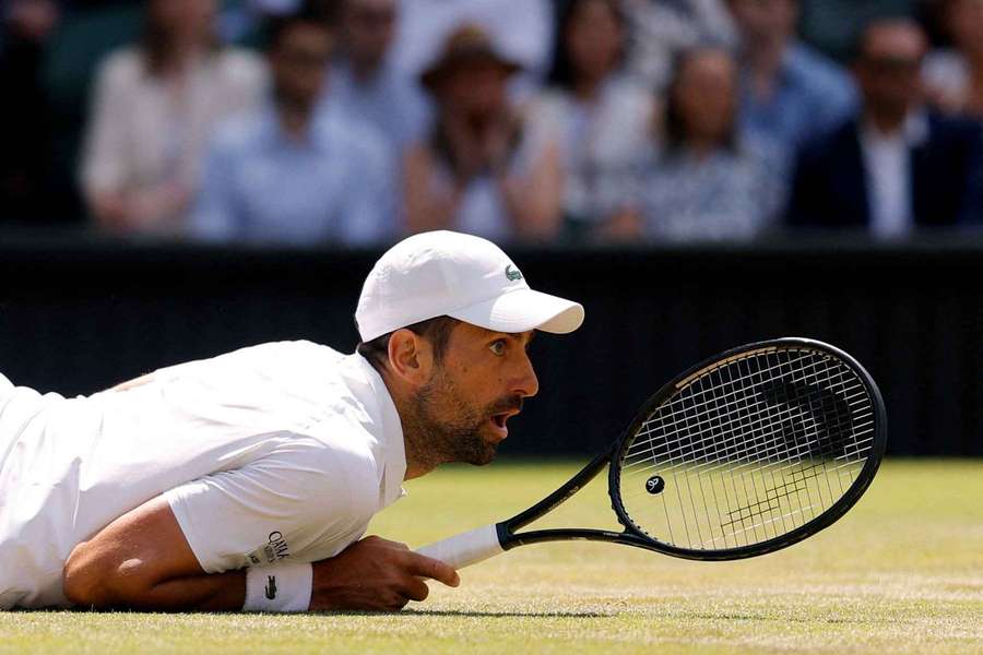 Djokovic watches on after hitting a shot Djokovic watches on after hitting a shot
