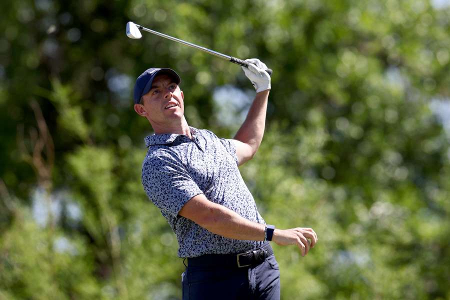 Rory McIlroy of Northern Ireland plays his shot from the 11th tee