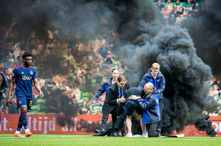 Smoke bombs were thrown onto the pitch