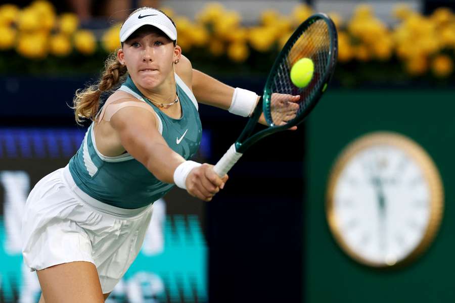 Mirra Andreeva plays a backhand against Elena Rybakina in their semi-final clash on Friday