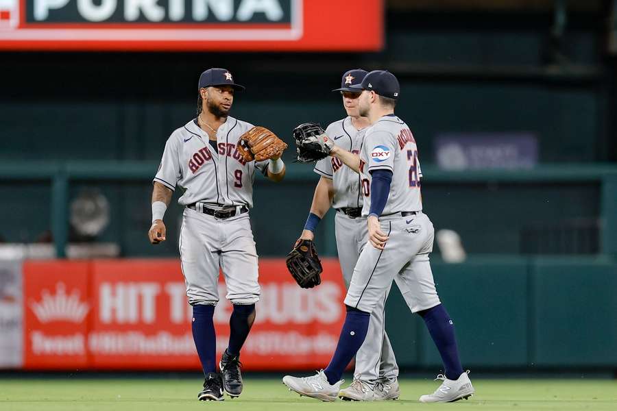 Houston Astros outfielders congratulate eachother