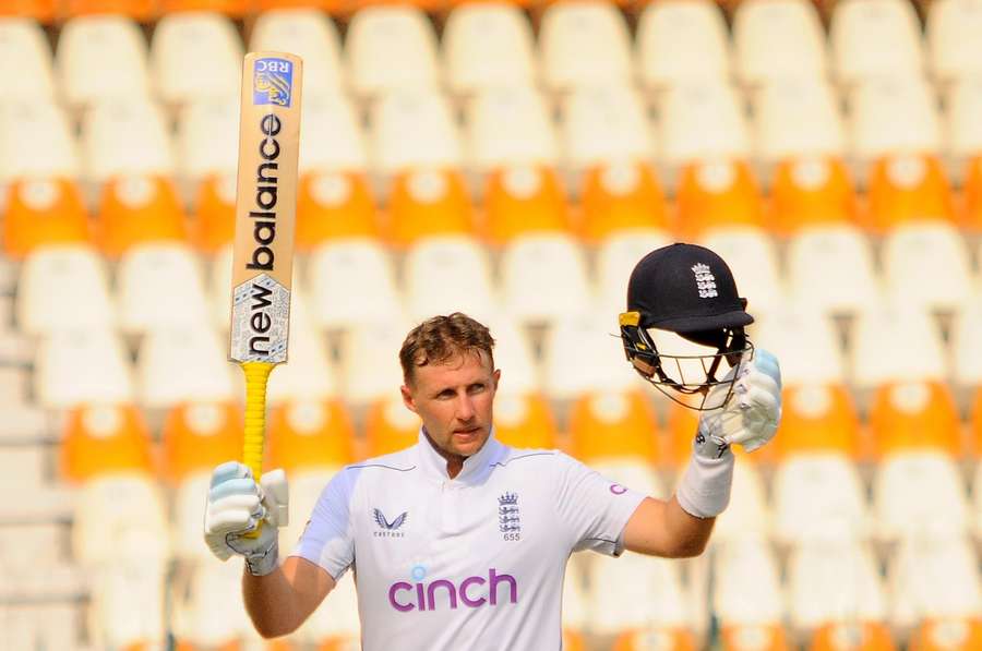 Root celebrates his century