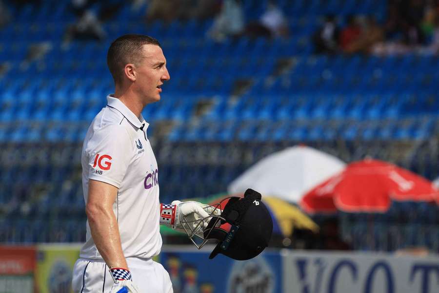 England's Harry Brook walks off after being caught by Pakistan's Shan Masood off the bowling of Saim Ayub in the first Test in Multan