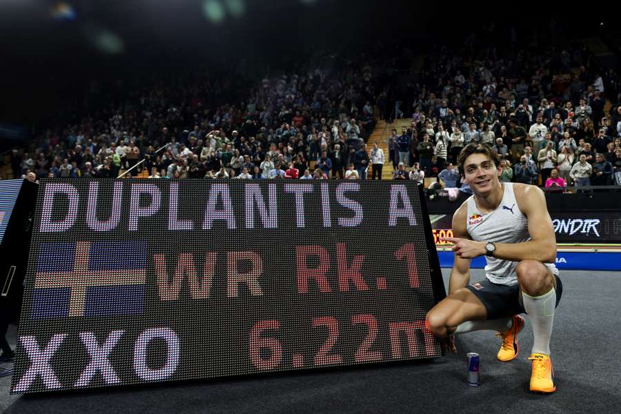 Swedish athlete Armand Duplantis poses for a photograph as he celebrates after setting a new pole vault world record