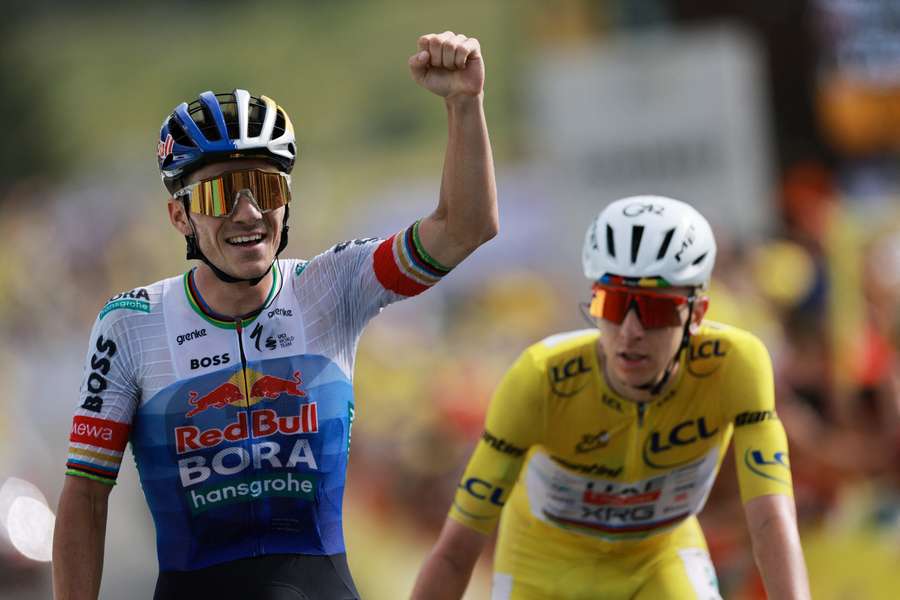 Remco Evenepoel celebrates his win ahead of Tadej Pogacar Remco Evenepoel celebrates his win ahead of Tadej Pogacar