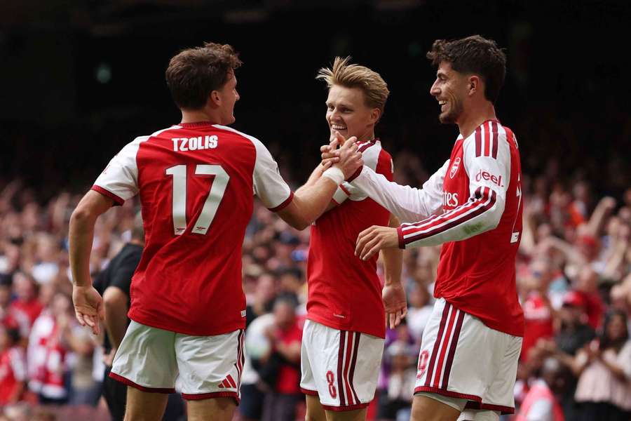 Arsenal's players celebrate against Man City Arsenal's players celebrate against Man City