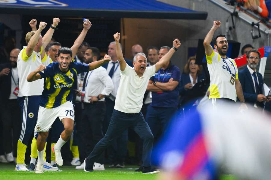 Fenerbahce celebrate qualifying for the Champions League proper for the first time in 18 years.