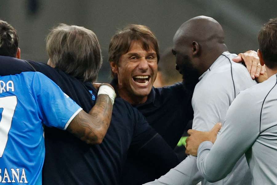 Conte (C) has taken Napoli to the top of Serie A