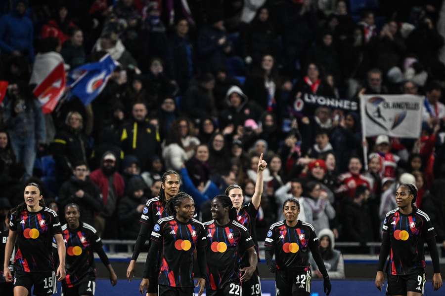 OL Lyonnes celebrate one of the goals scored during their victory over Wolfsburg.