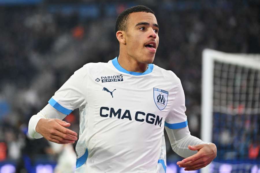 Marseille's English forward #10 Mason Greenwood celebrates scoring his team's first goal against Lyon