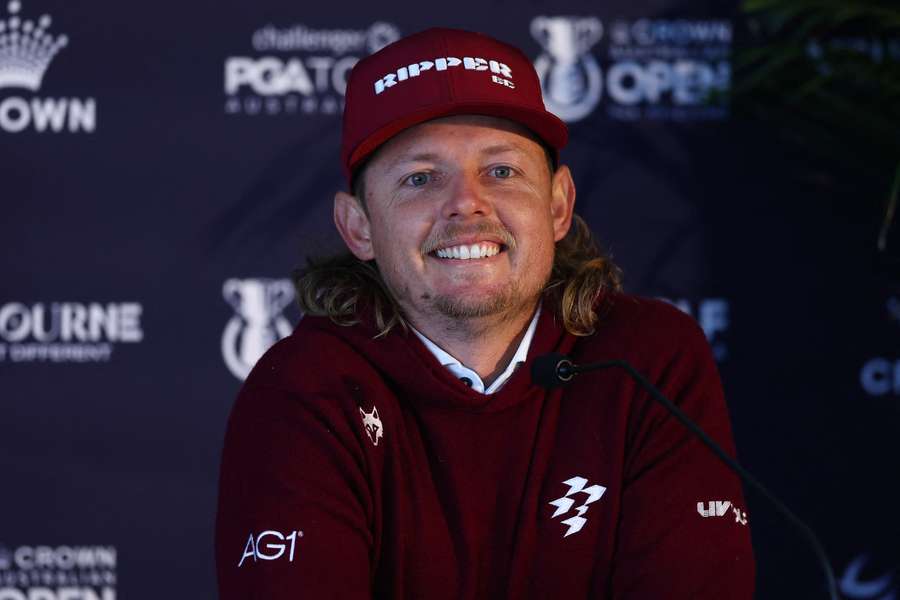 A jovial Smith speaks to reporters at Royal Melbourne Golf Club on Tuesday morning. 
