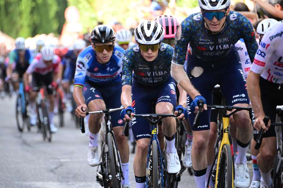 Jonas Vingegaard (centre) in action with riders during Stage 2