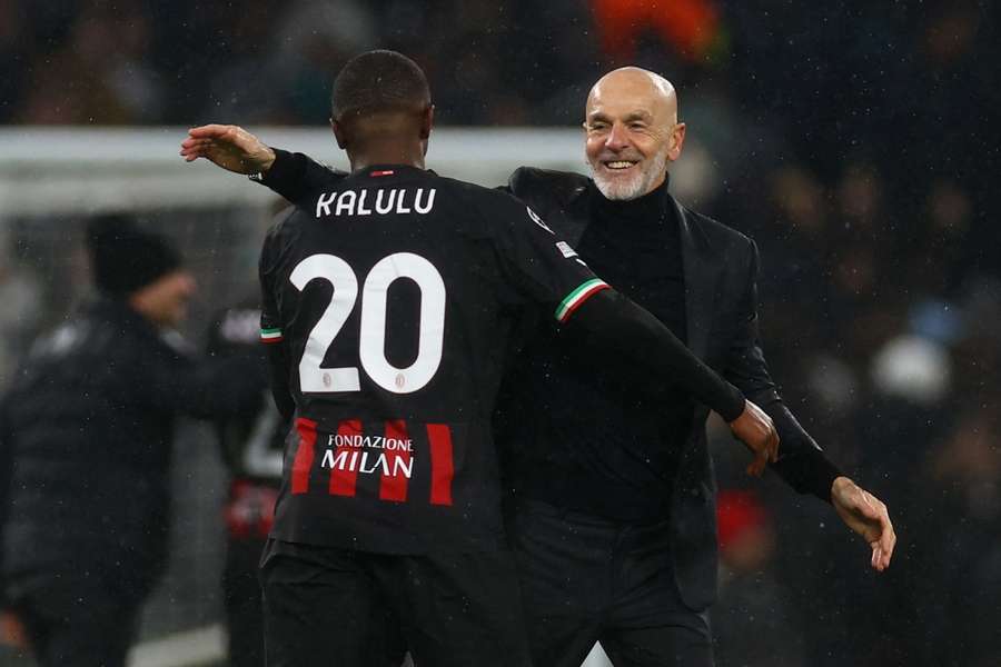 Pioli celebrates with defender Pierre Kalulu