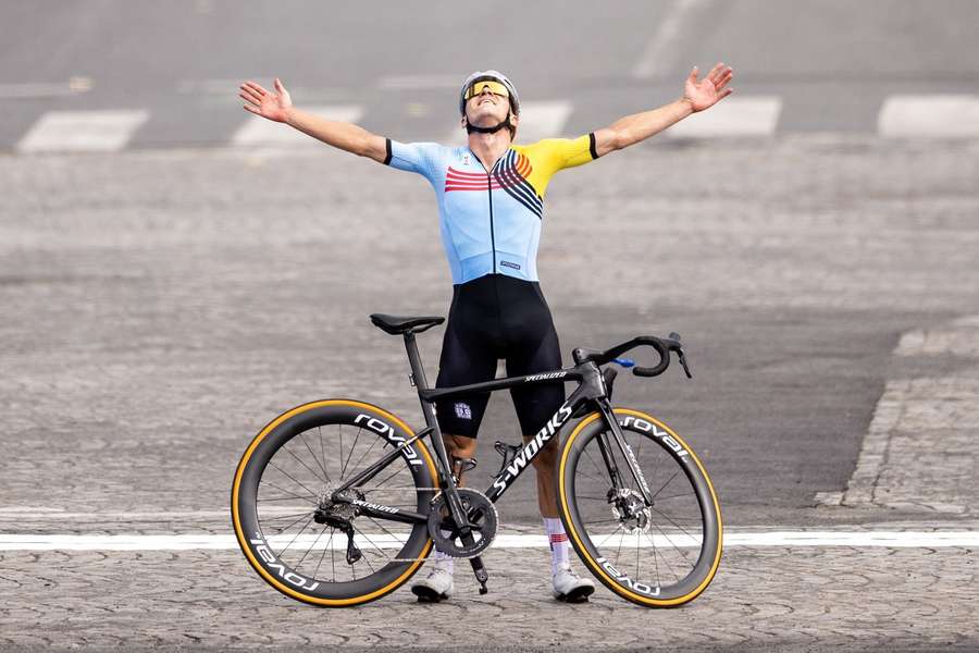 Remco Evenepoel celebrates after winning the road race