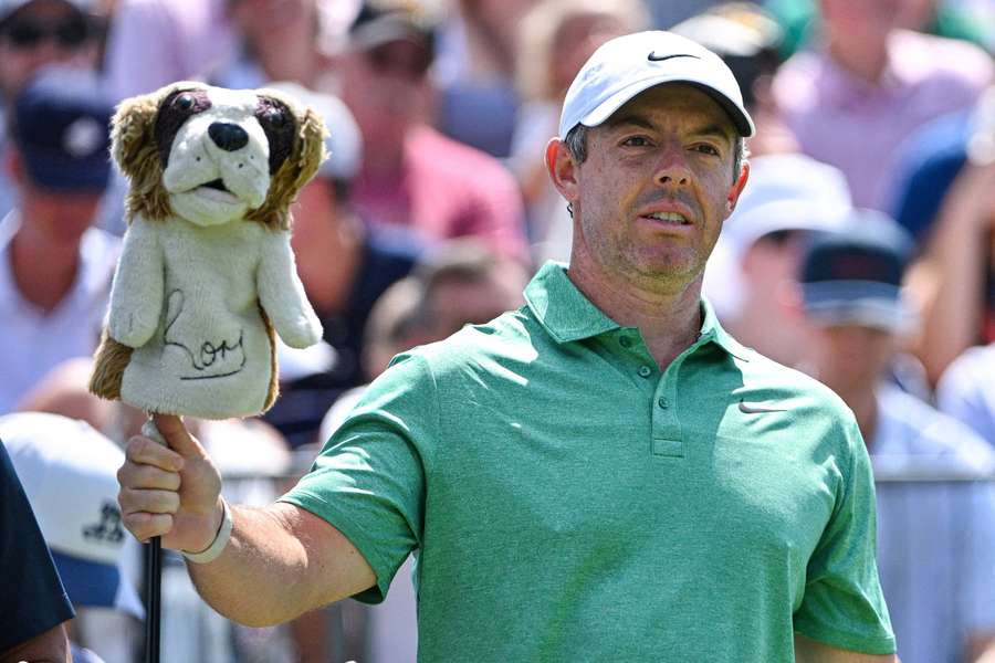 Rory McIlroy grabs a club on the first tee during the final round of the BMW Championship golf tournament