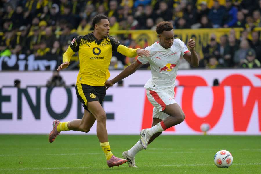 Dortmund's Felix Nmecha (left) and Leipzig's Assan Ouedraogo vie for the ball