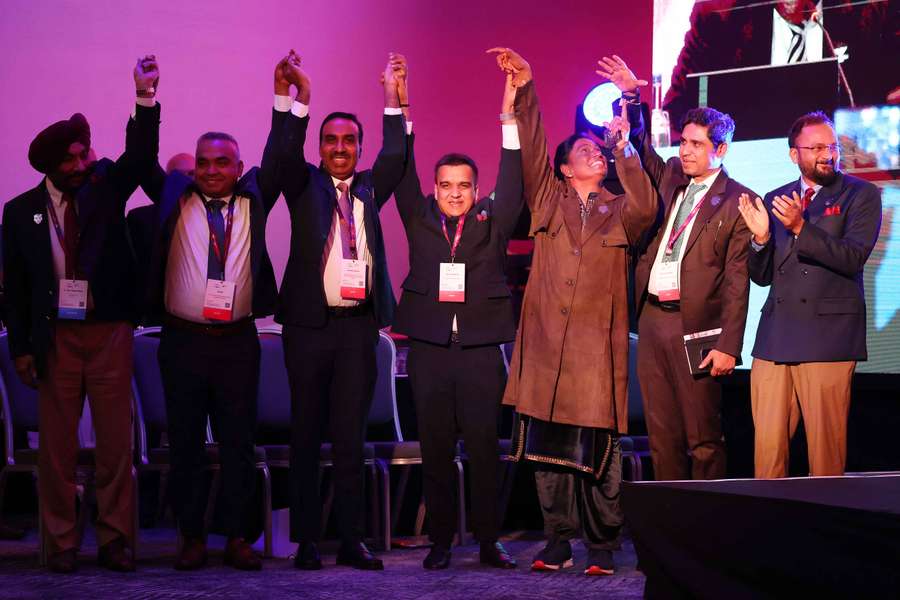 The Indian Commonwealth Games Delegation celebrates after the announcement