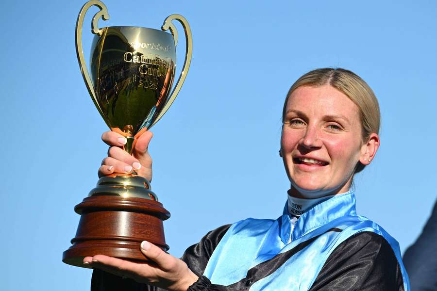 Jamie Melham poses with the 2025 Caulfield Cup, winning the race with Melbourne Cup co-favourite Half Yours.