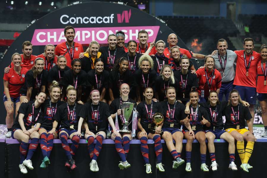 Becky Sauerbrunn of the USA and her teammates celebrate winning the Concacaf Women Championship