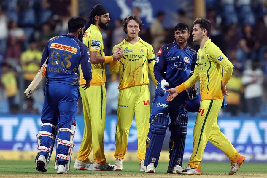 Players shake hands after the game