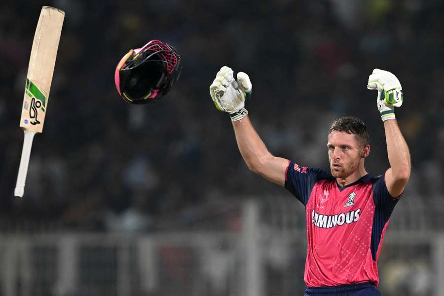 Jos Buttler throws his bat and helmet after securing the victory