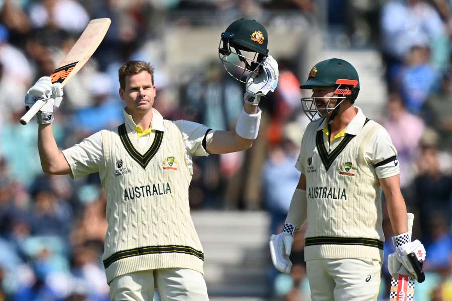 Australia's Steve Smith (L) celebrates his century