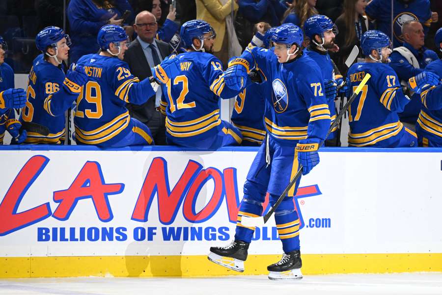 Buffalo Sabres players celebrate a goal