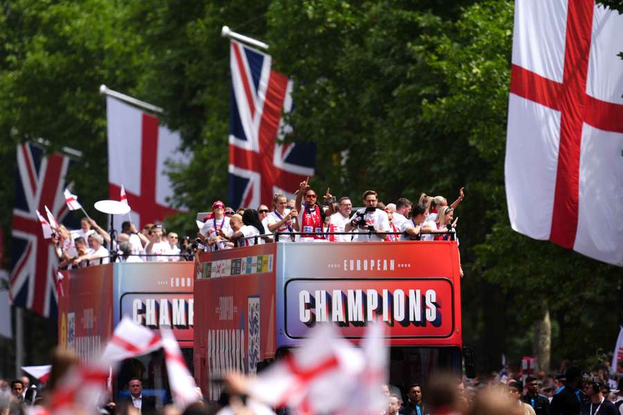 England's Lionesses celebrate their Euro 2025 triumph during a bus parade in London