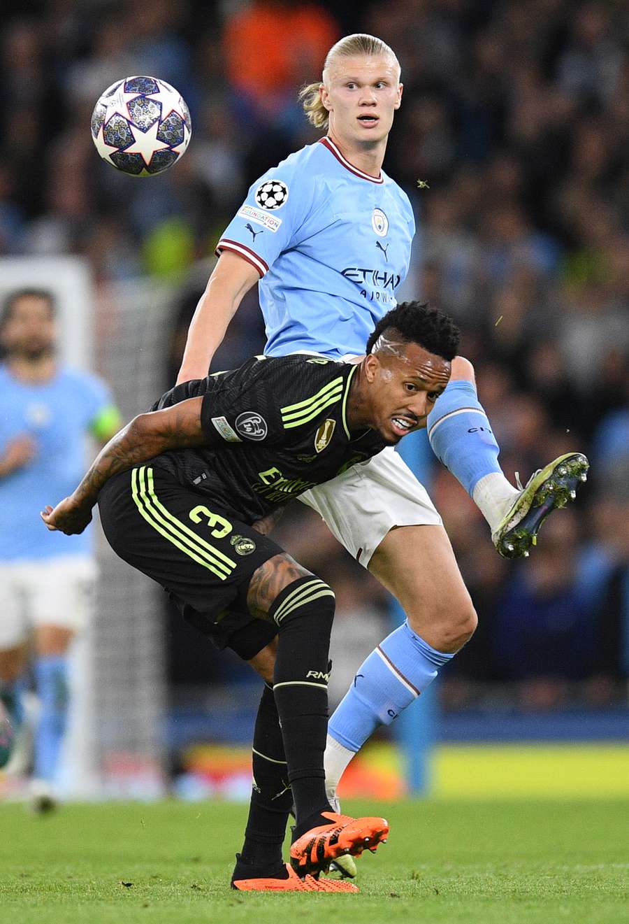 Eder Militao vies with Erling Haaland Eder Militao vies with Erling Haaland